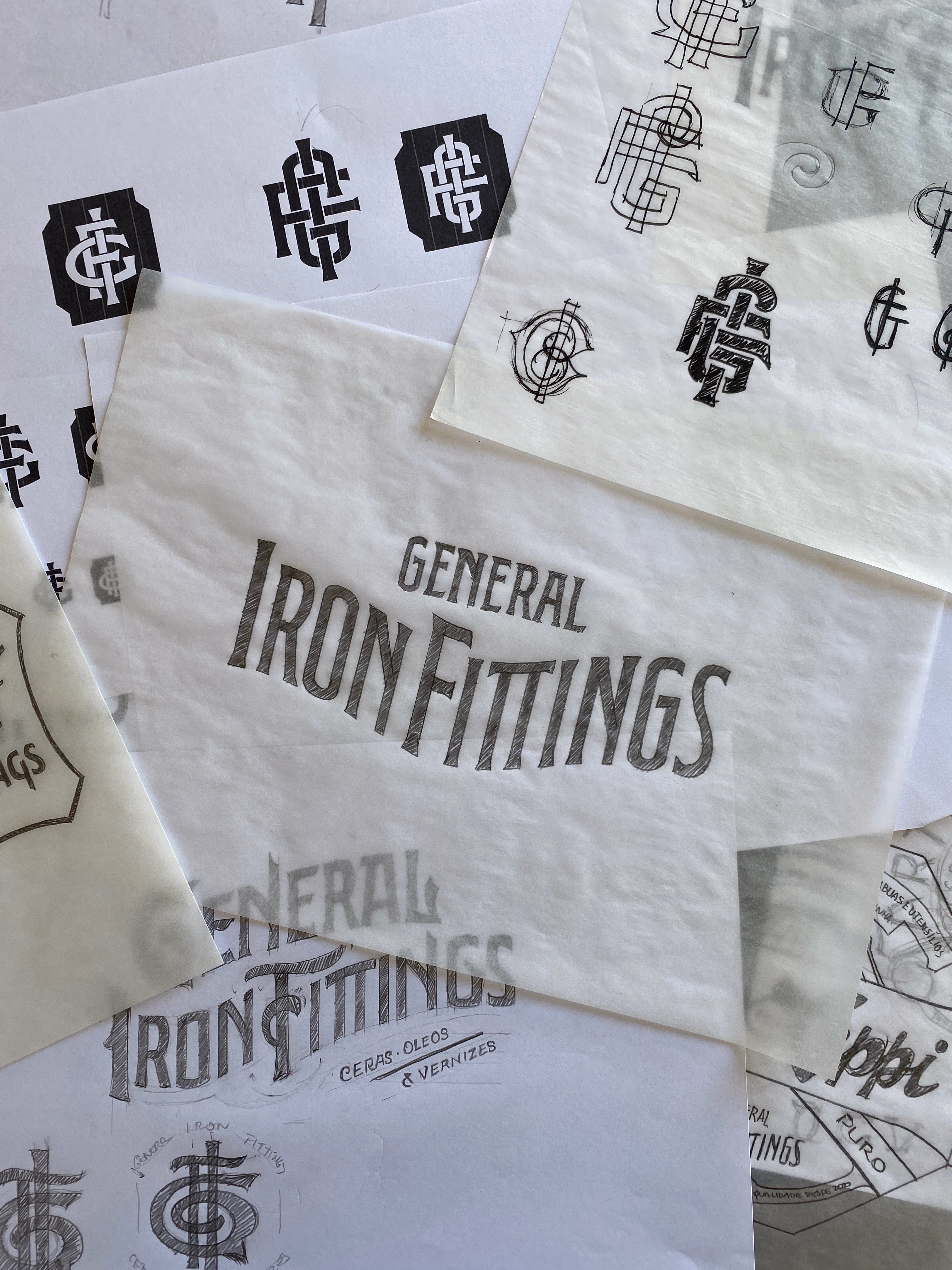 Hand-drawn lettering and monogram studies for General Iron Fittings on tissue papers